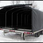 The backdoor rolls up and is secured by a strap and a buckle for simple operation during cold temperatures. 