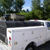 A bi-fold service body topper for Interstate Power Systems