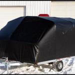 The front access panel closes securely to protect your snowmobiles as you travel down the road.