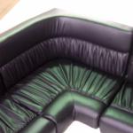 Black vinyl and ruching give this upholstery a look not often seen. 
